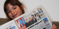 kind liest Zeitung
